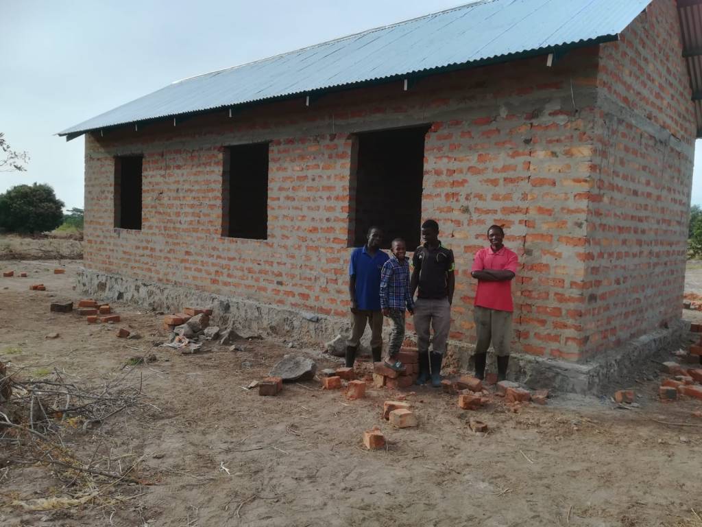 This building has 2 rooms and our office. Stephan, Hussein and Simon are 3 of our seven strong team.